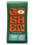 A green bag of coffee labeled "Goshen Coffee Roasters" in bold orange lettering. It is a dark roast with the description "Heavy Feels French Blend" and features flavor notes of "Rich Cocoa, Bold Tobacco." The bag contains whole beans and has a net weight of 12 ounces (340g).