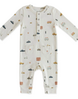 A white baby romper with multicolor car, bus and scooter print all over, metal snaps at collar and two pockets at hips. Photographed on white background.