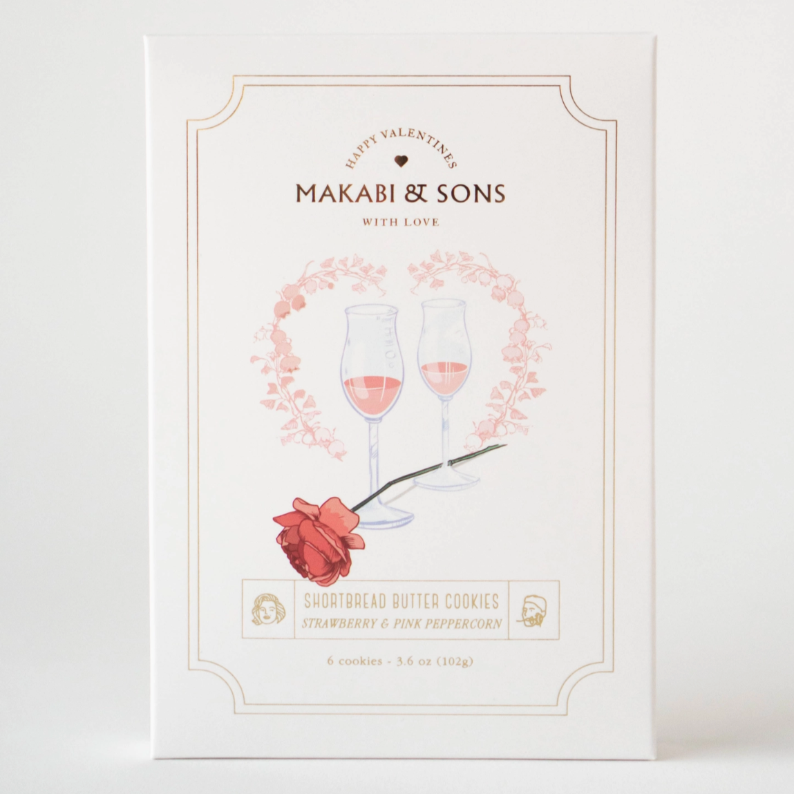 White box with Valentines Day rose and heart and ink champagne glasses on cookie box