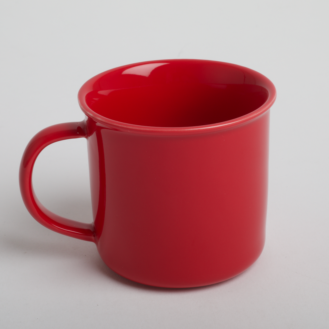 Red mug on a light gray background