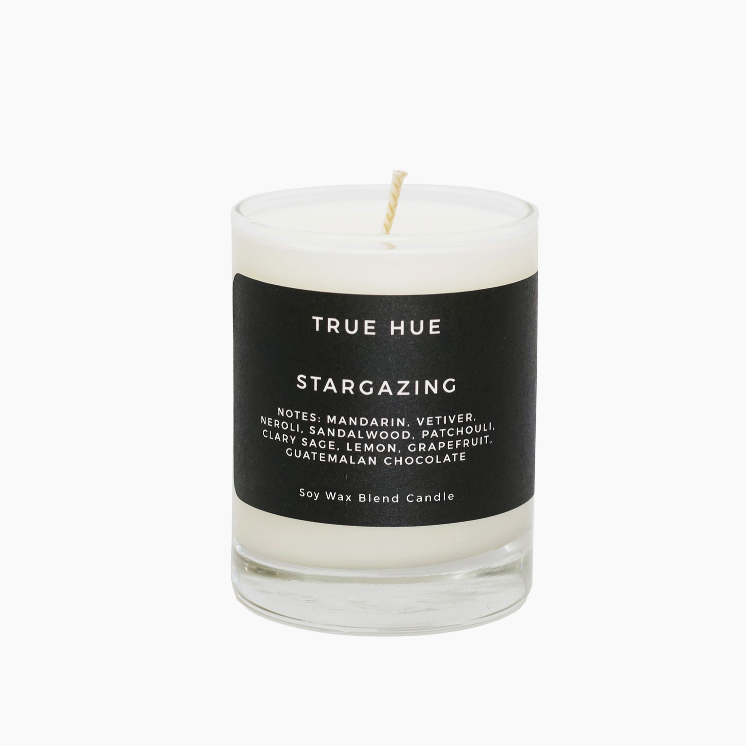 True Hue candle with a black label on a white background