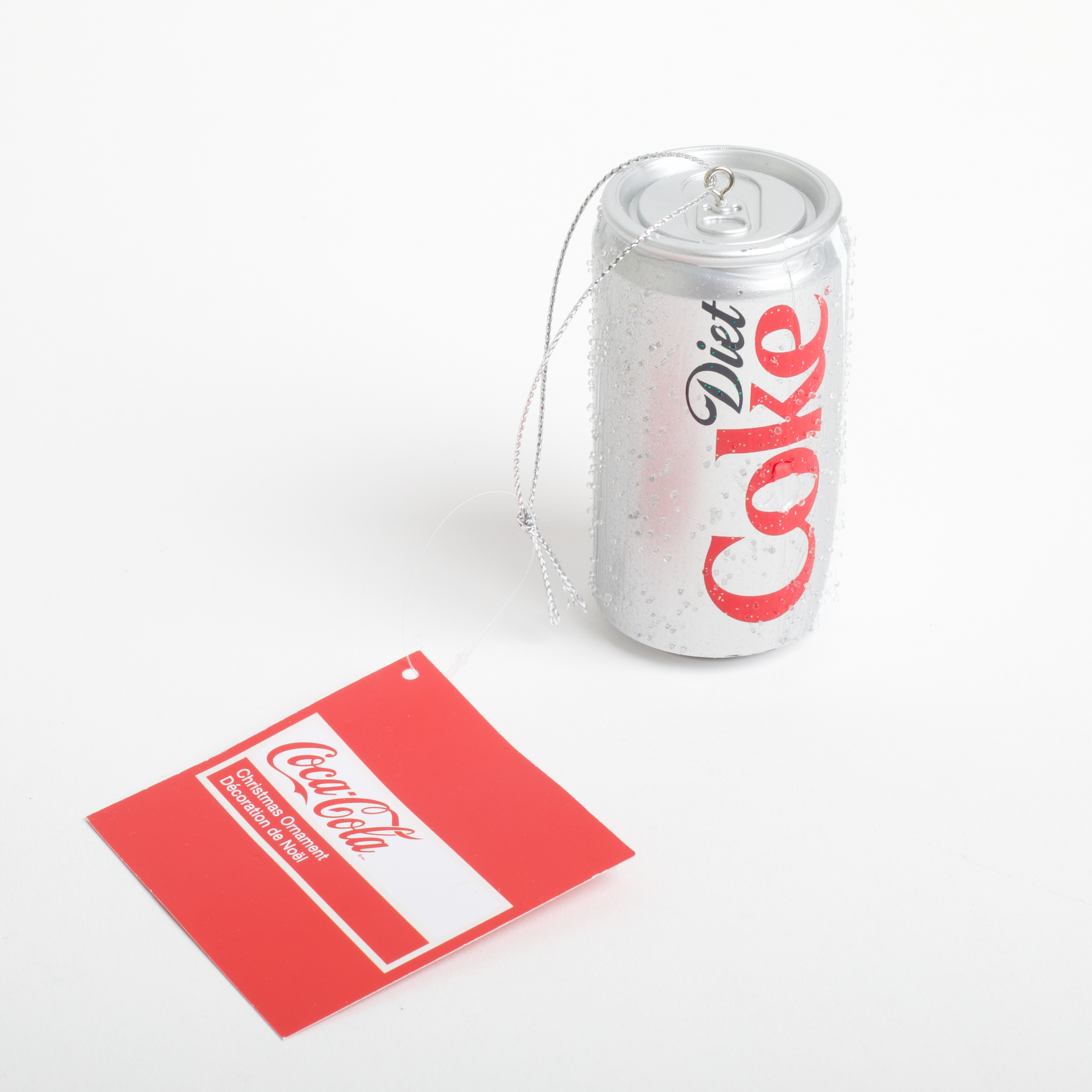 Coca-Cola can and packaging on a white background