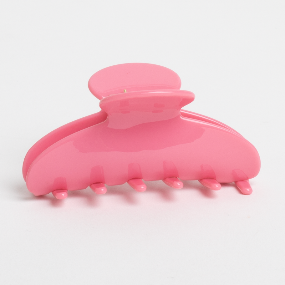 Pink hair clip on a white background