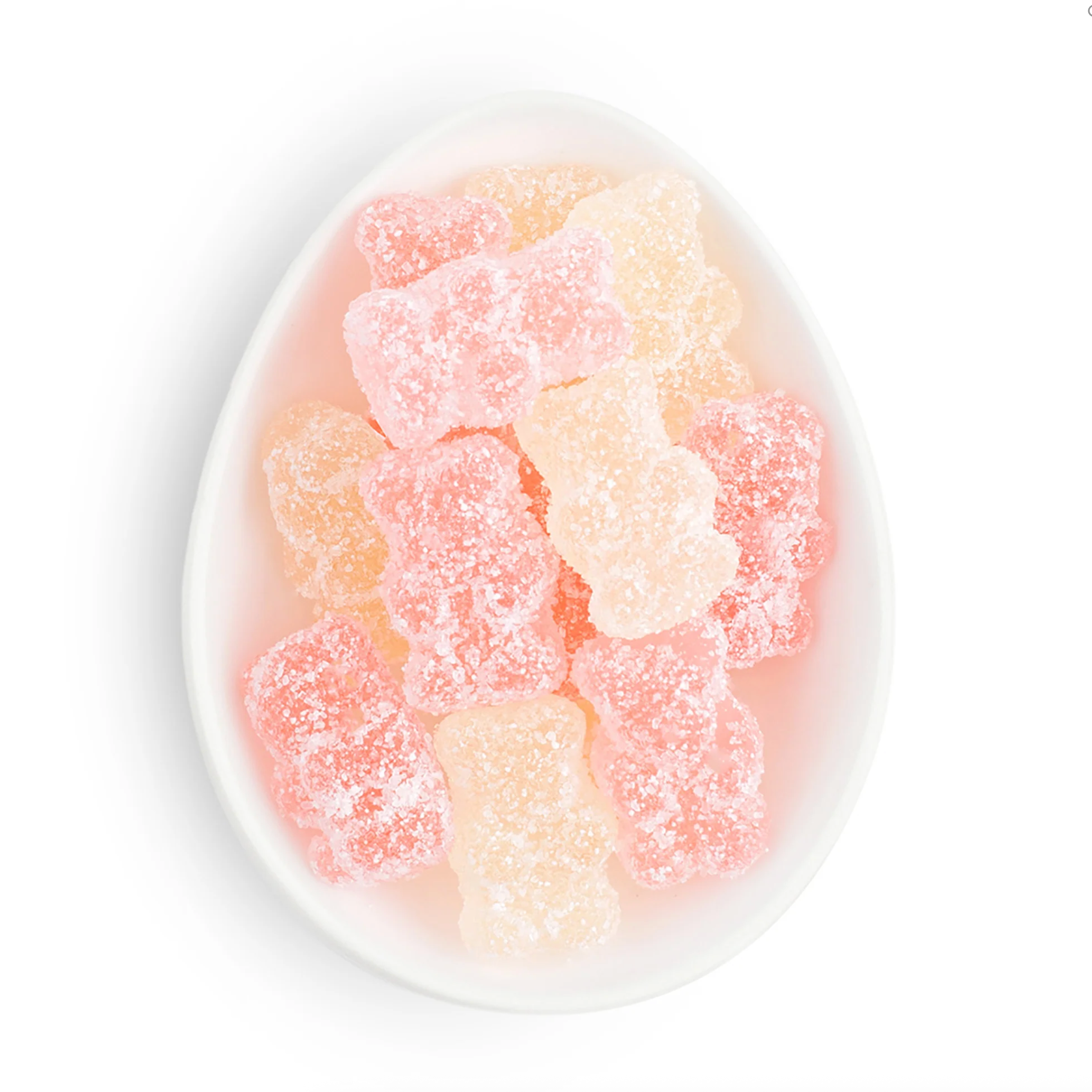 Gummy bears in a white bowl on a white background