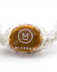 Caramel candy with McCrea's logo on a white background