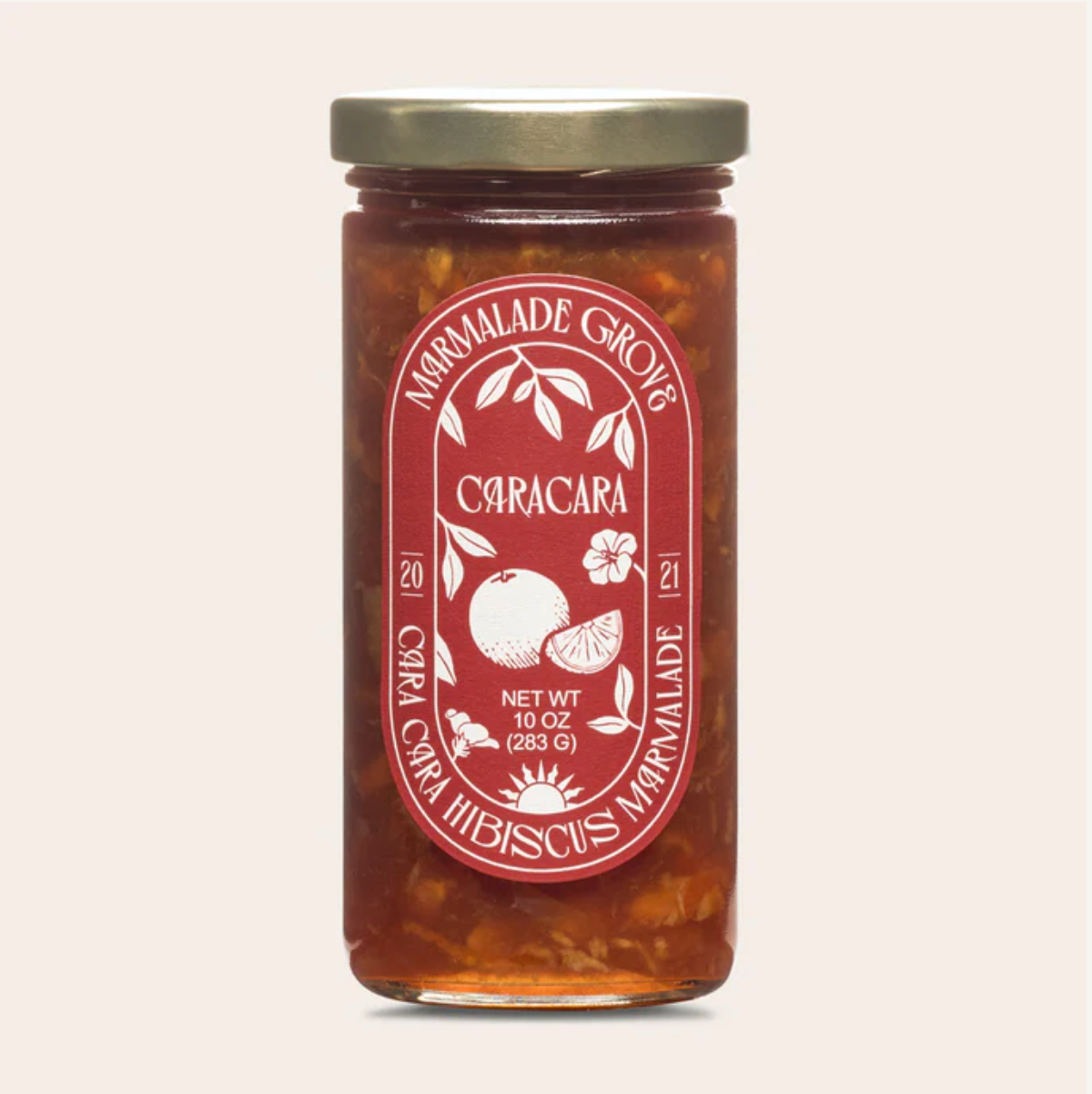 Jar of Caracara marmalade with a red label on a light gray background