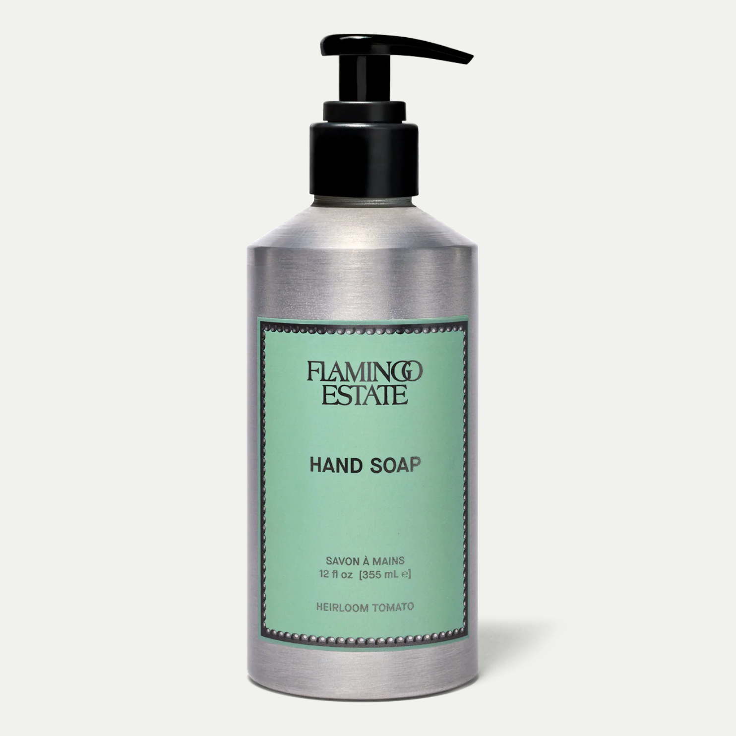 Hand soap bottle with green label on a white background