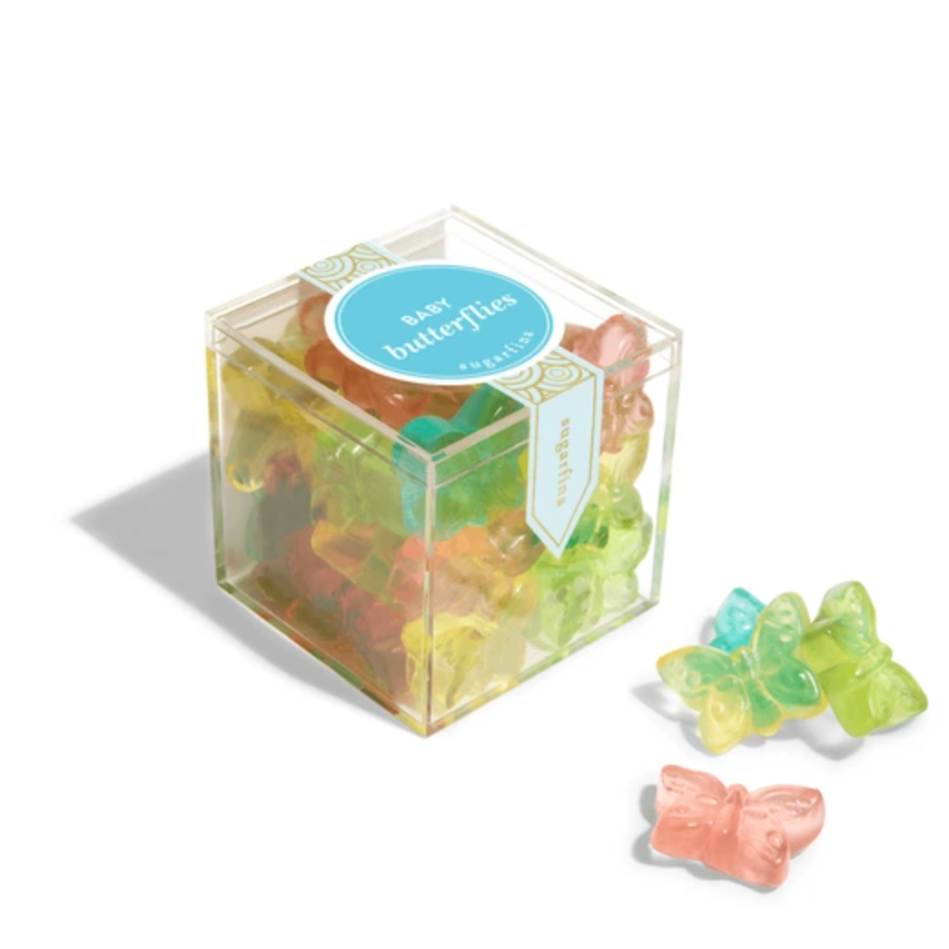 Butterfly-shaped gummy candies in a clear box with a blue label on a white background.