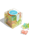Butterfly-shaped gummy candies in a clear box with a blue label on a white background.