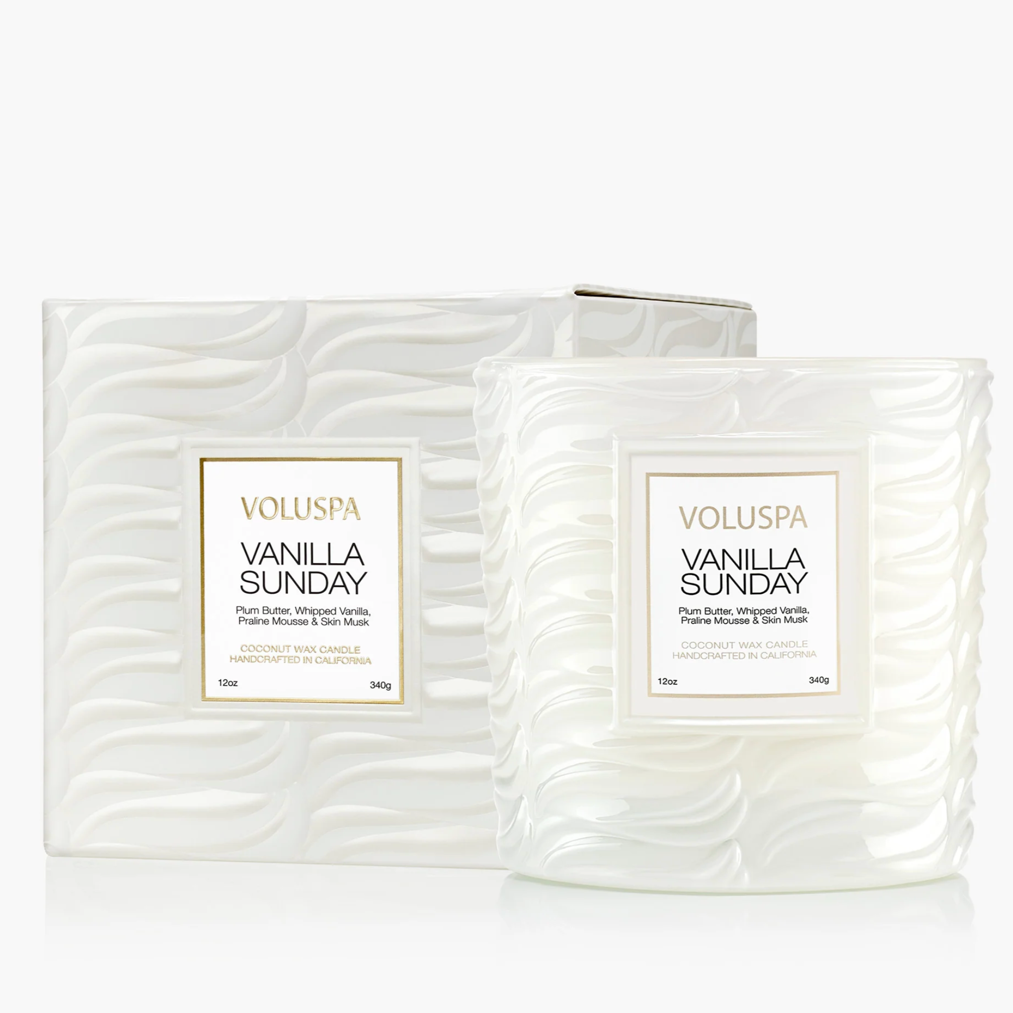 Two Voluspa Vanilla Sunday candles with packaging on a white background