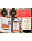 Gift set with Jack Rudy cocktail cherries, bourbon bears, and a glass on a white background