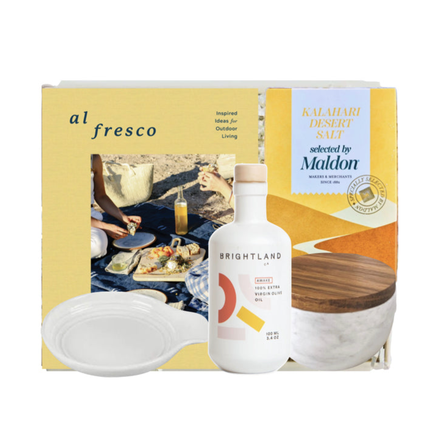 Gift set with a bottle of Brightland olive oil, a bowl, and a book titled 'al fresco' on a white background.