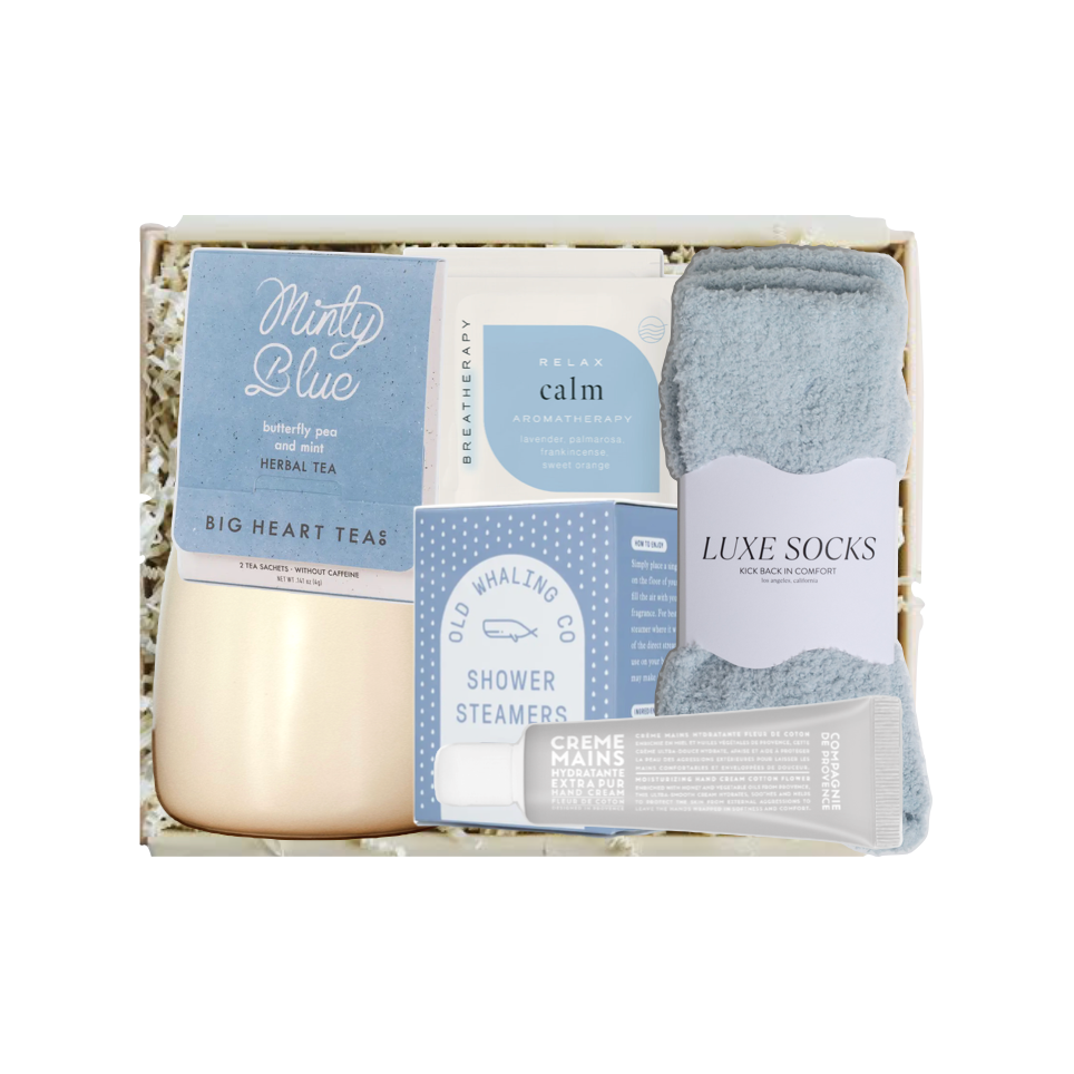 Packaged product with tea, soap, and socks on a white background