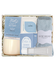 Packaged product with tea, soap, and socks on a white background