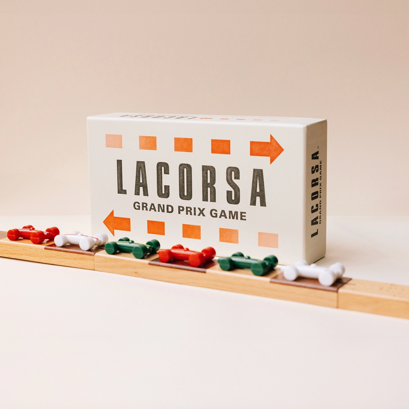 Lacorsa Grand Prix game box with toy cars on a white background