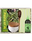 Pasta making kit with a wooden spoon, bowl, and bottle of olive oil on a white background