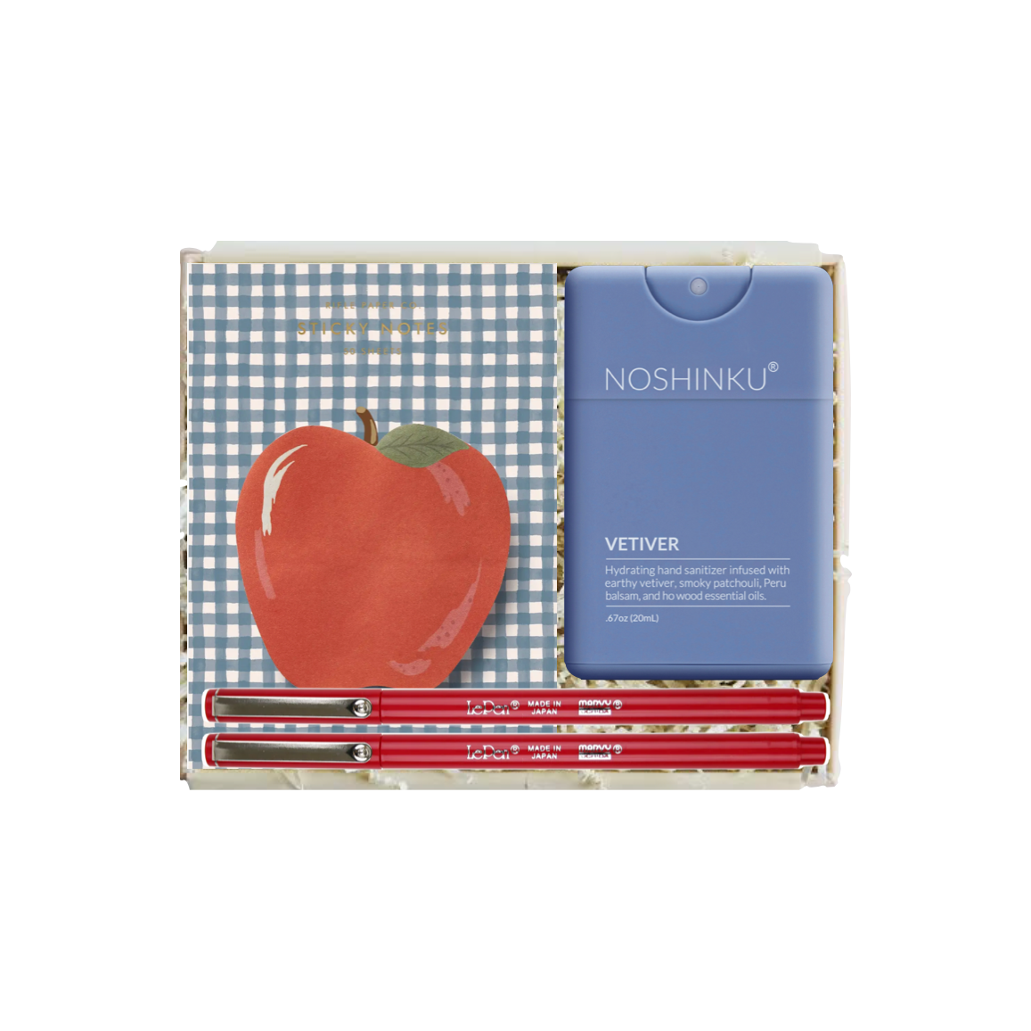Noshinku Vetiver hand sandalwood essential oil kit in a gift box, featuring a blue plastic bottle, three red pencils, and a red apple illustration on a blue-and-white checkered background.