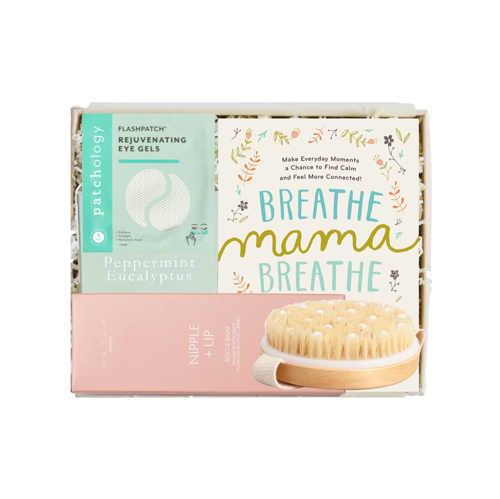 A boxed skincare set from Patchology displayed in a white tray. The set includes a Peppermint Linalool eye gel tube with a mint green label, a pink nipple lip balm tube, and a card that reads 'BREATHE mama BREATHE' with a wooden bristle brush pictured on the front.