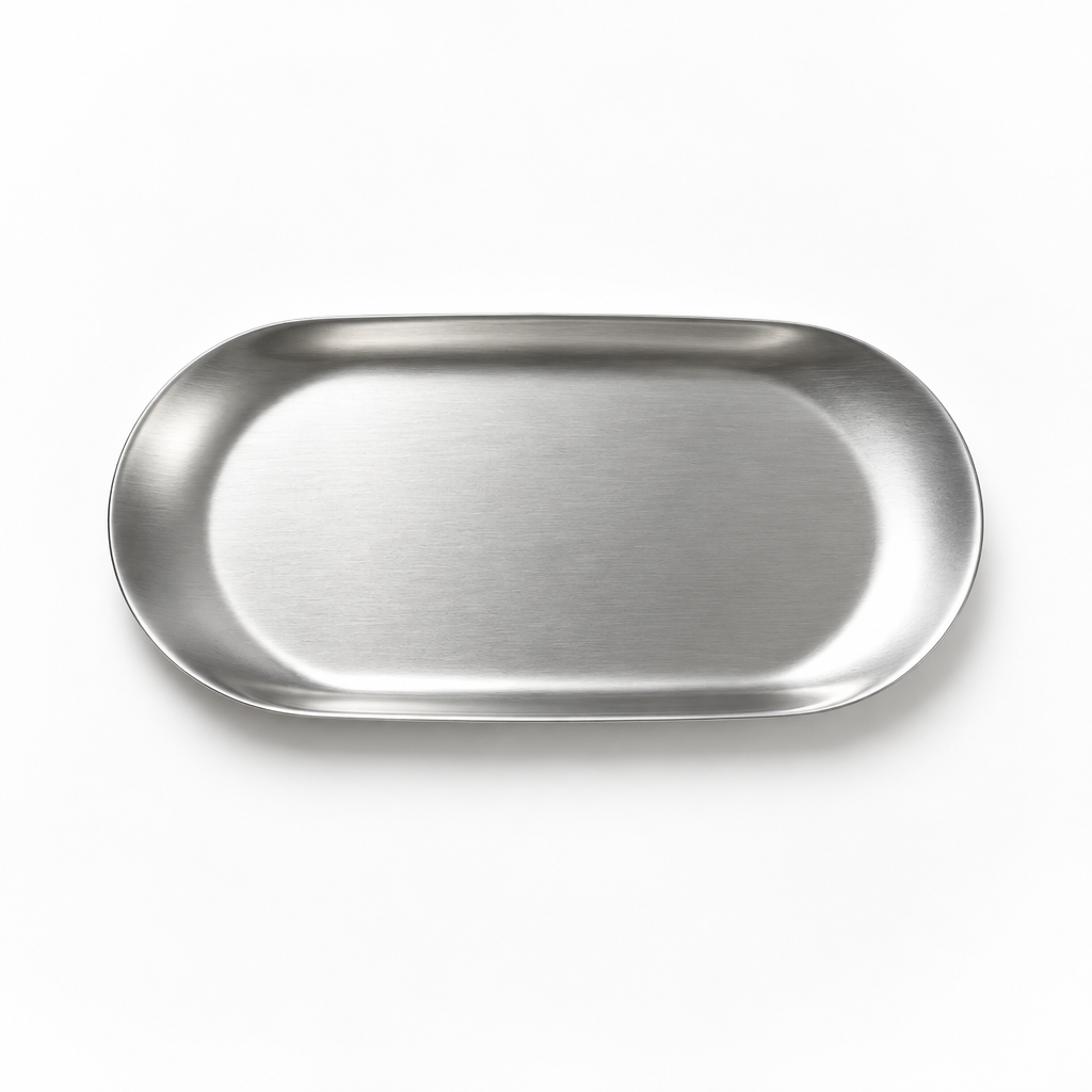 An oval metal tray with a brushed silver finish, photographed from directly above on a clean, light gray background.