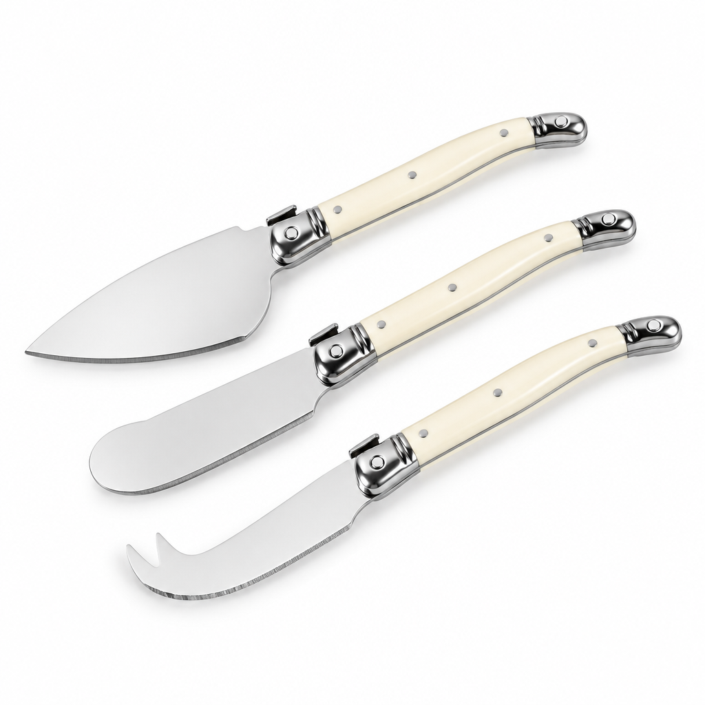 Three cheese knives with cream-colored handles and silver stainless steel blades, arranged diagonally on a plain white background.