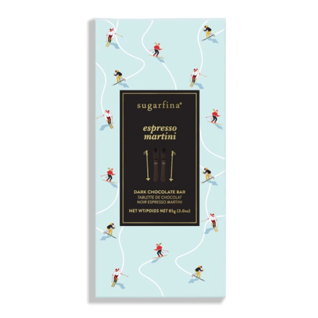 A sugarfina espresso martini dark chocolate bar in its packaging, featuring a light blue background with whimsical illustrations of skiers and a large black central label.