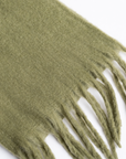 An olive green mohair scarf with white embroidered monogram initials 'E/B' on a clean white background.