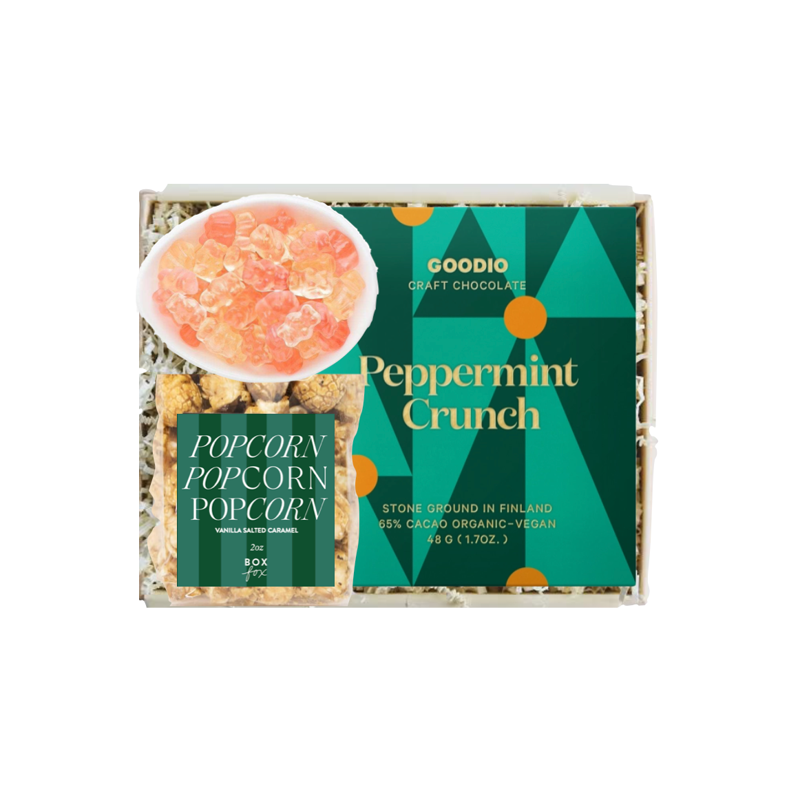 A boxed snack product labeled Goodio Craft Chocolate Peppermint Crunch, shown on a plain white background. The package includes a green front label, a smaller side label, and a photo of pink peppermint candy on popcorn.