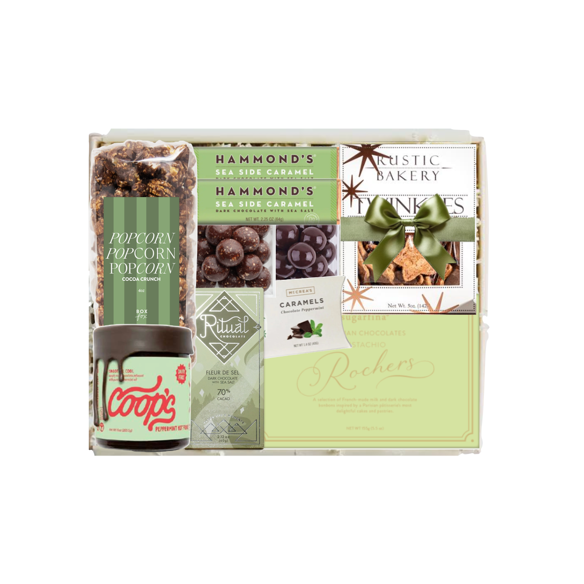 A curated gourmet gift box containing a jar of Coops' chocolate, Hammond's sea salt caramel popcorn, gourmet caramels, and a card from Rustic Bakery, arranged inside a clear plastic gift tray on a white background.