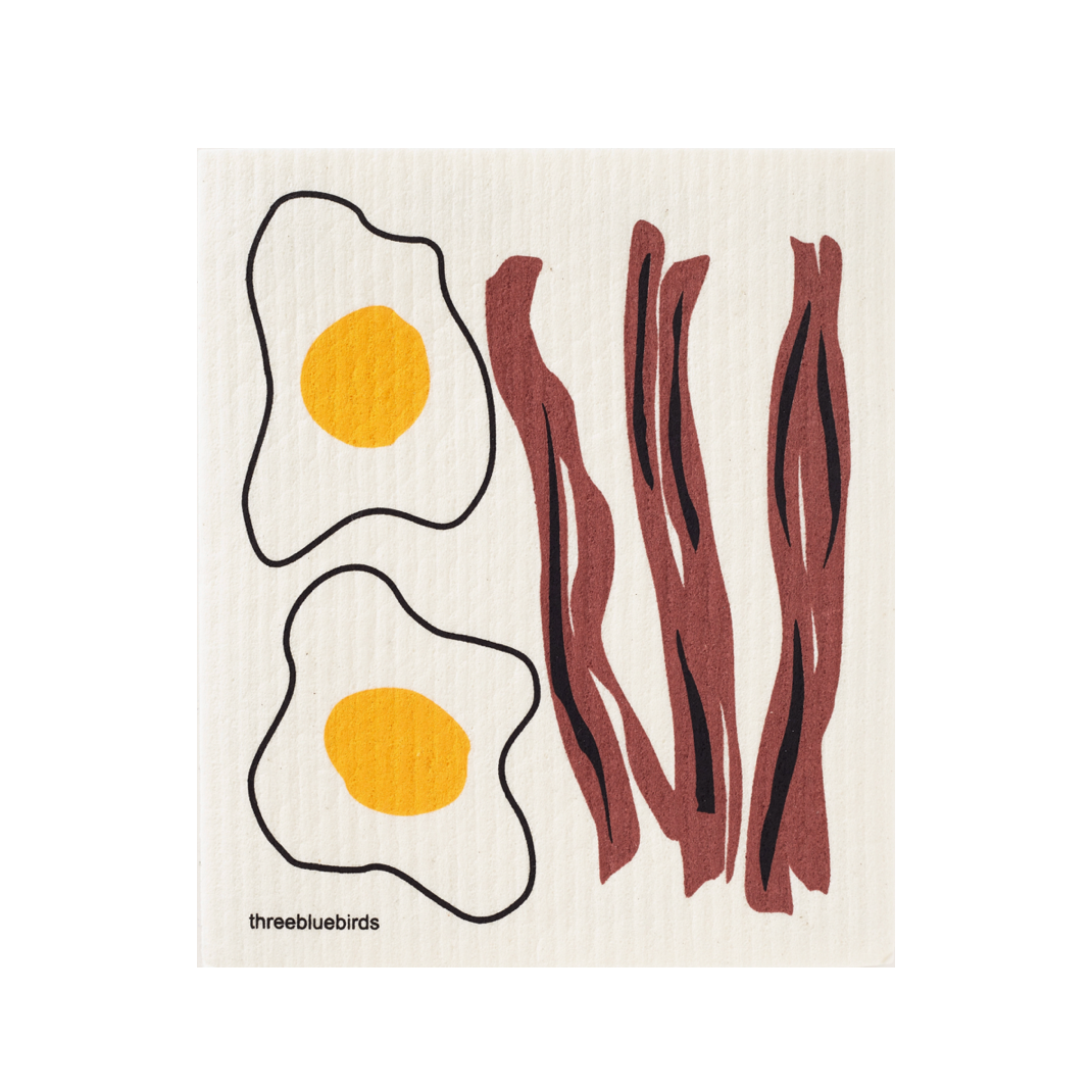 three bluebirds eggs and bacon swedish dishcloth on a white background