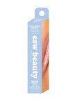 A boxed cosmetic product labeled 'esw beauty' and 'white pitaya coconut' stands upright on a plain white background. The package is primarily light blue with peach/orange side panels and a lip photo printed on the front.