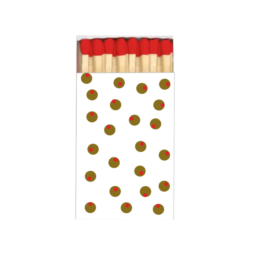 A stylized matchbox illustration on a plain white background, with red match heads, beige wooden matches, and several small red-and-green circular dots printed on the front.