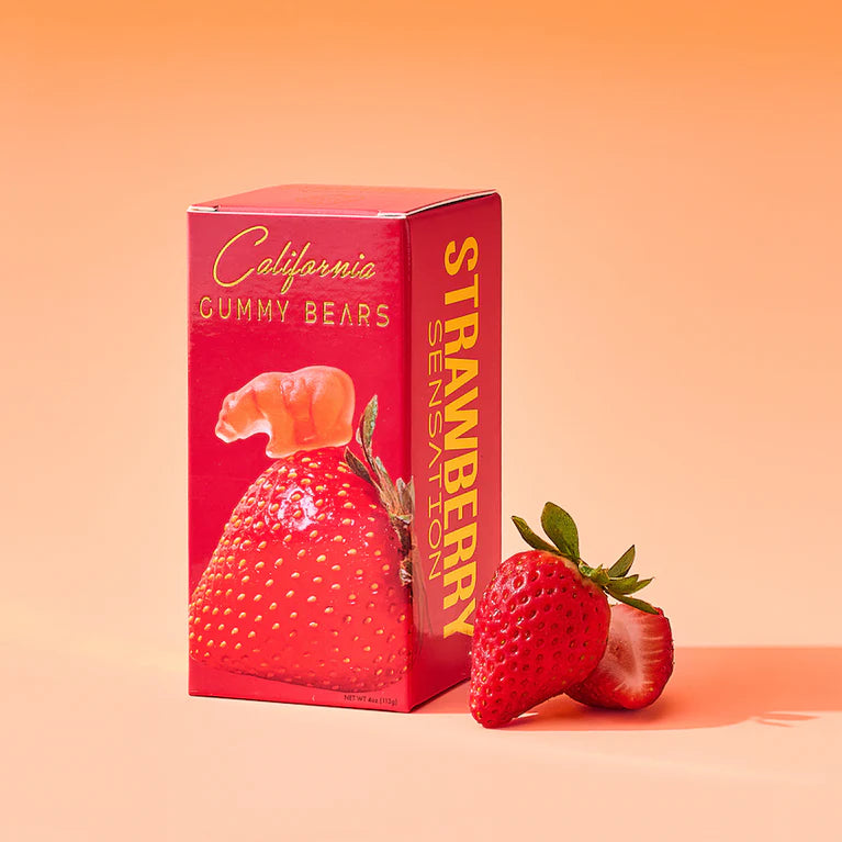 Box of California Gummy Bears Strawberry Sensation with strawberries on a peach background