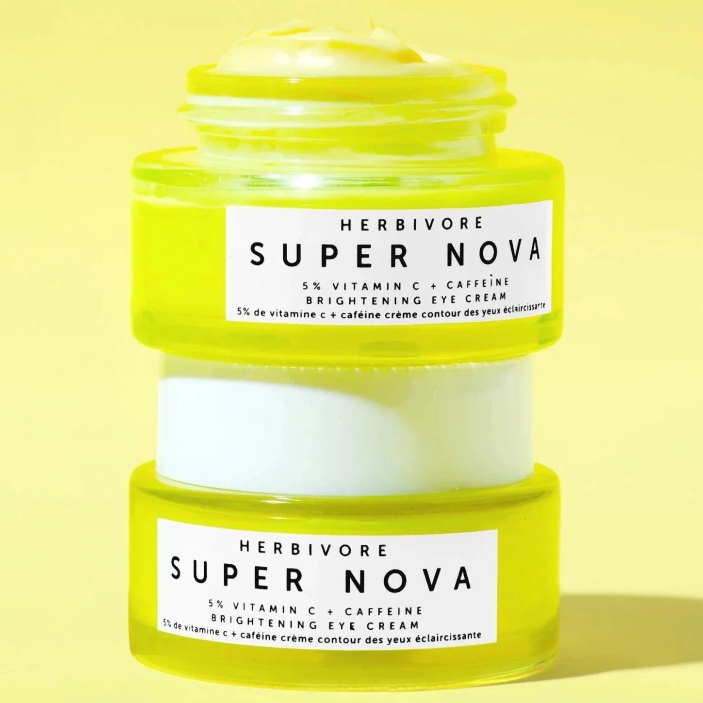 Two Super Nova Brightening Eye Cream on yellow background.