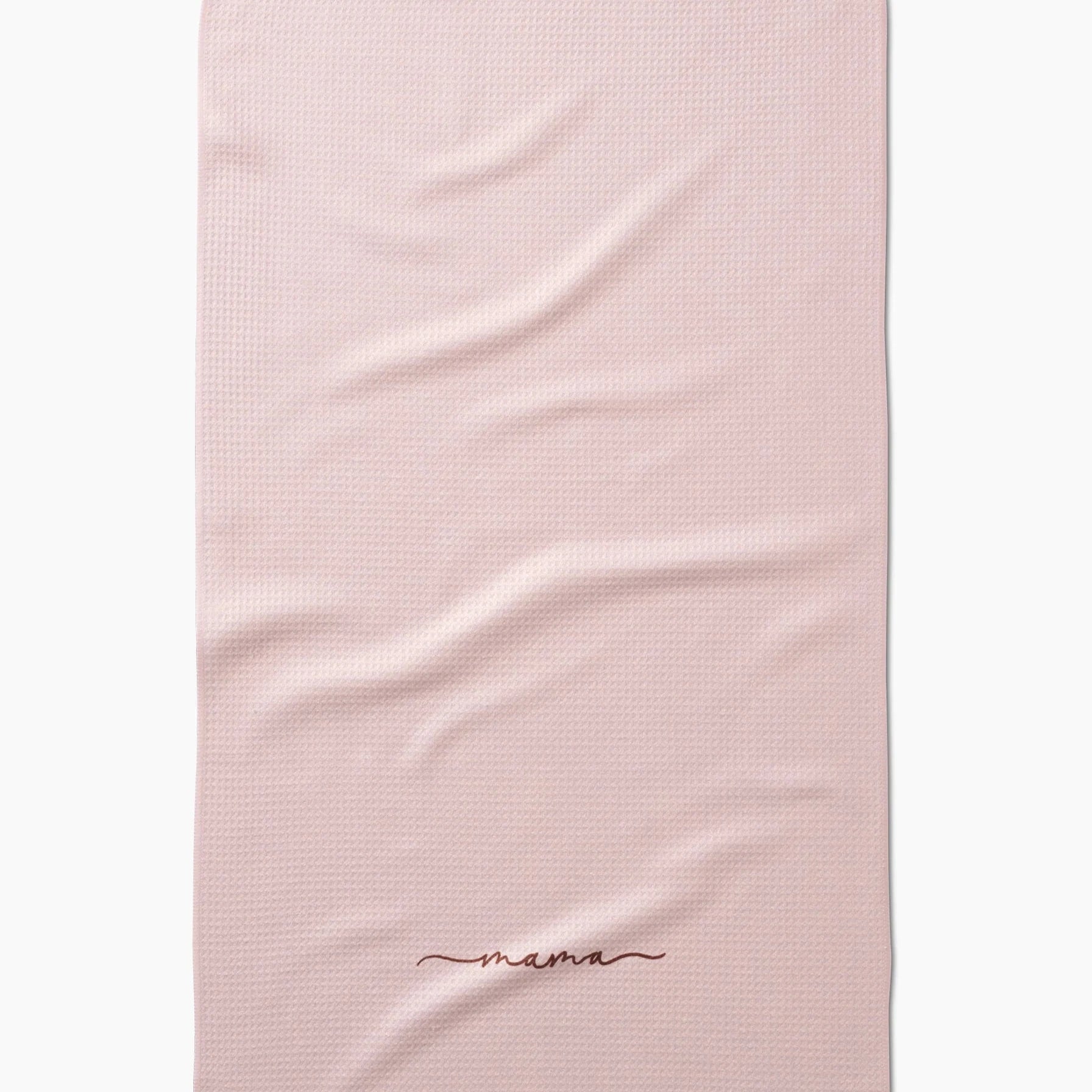 light pink tea towel that says 'mama' on it in red