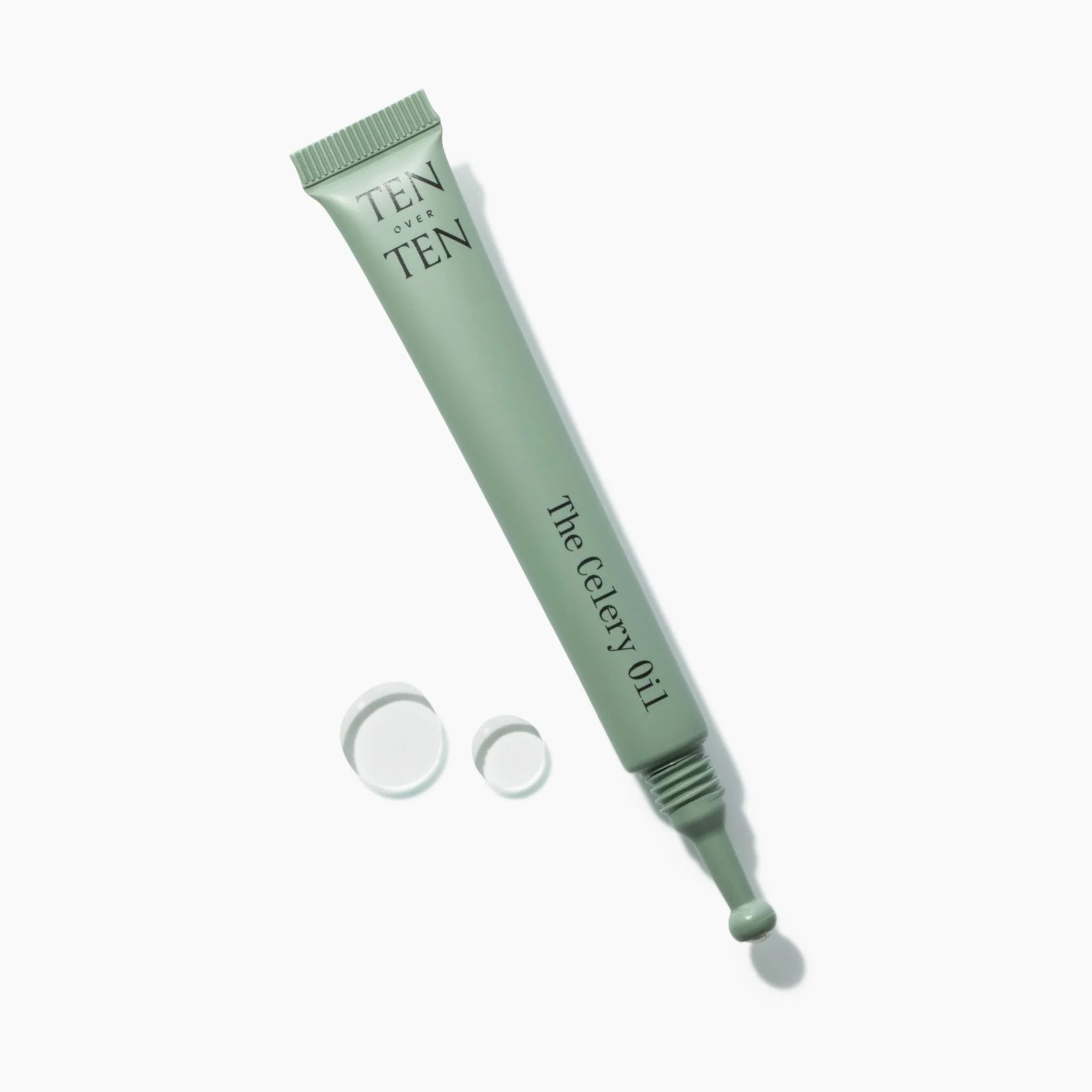 Green tube of 'The Celery Oil' by 'Ten of Ten' on a white background