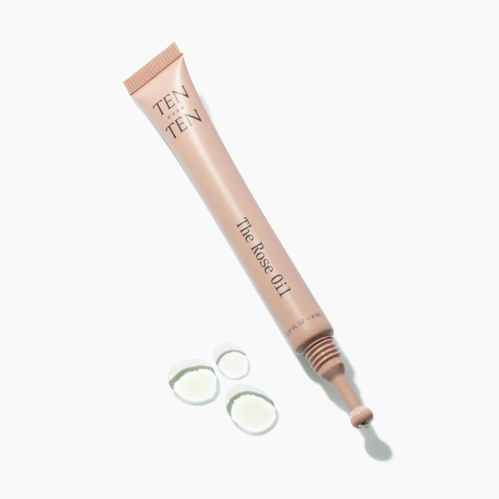Cosmetic tube labeled 'TEN' with applicator on a white background