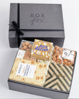 Black BOXFOX packed with food gift items