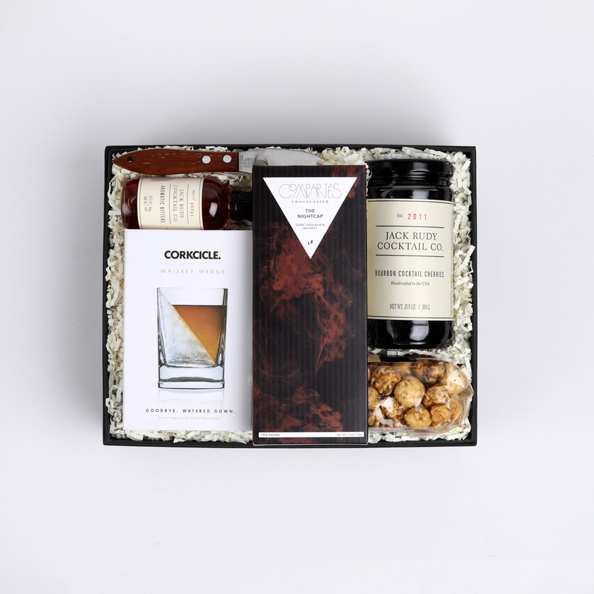 BOXFOX the Whiskey Business Gift Box filled with ivory crinkle paper.