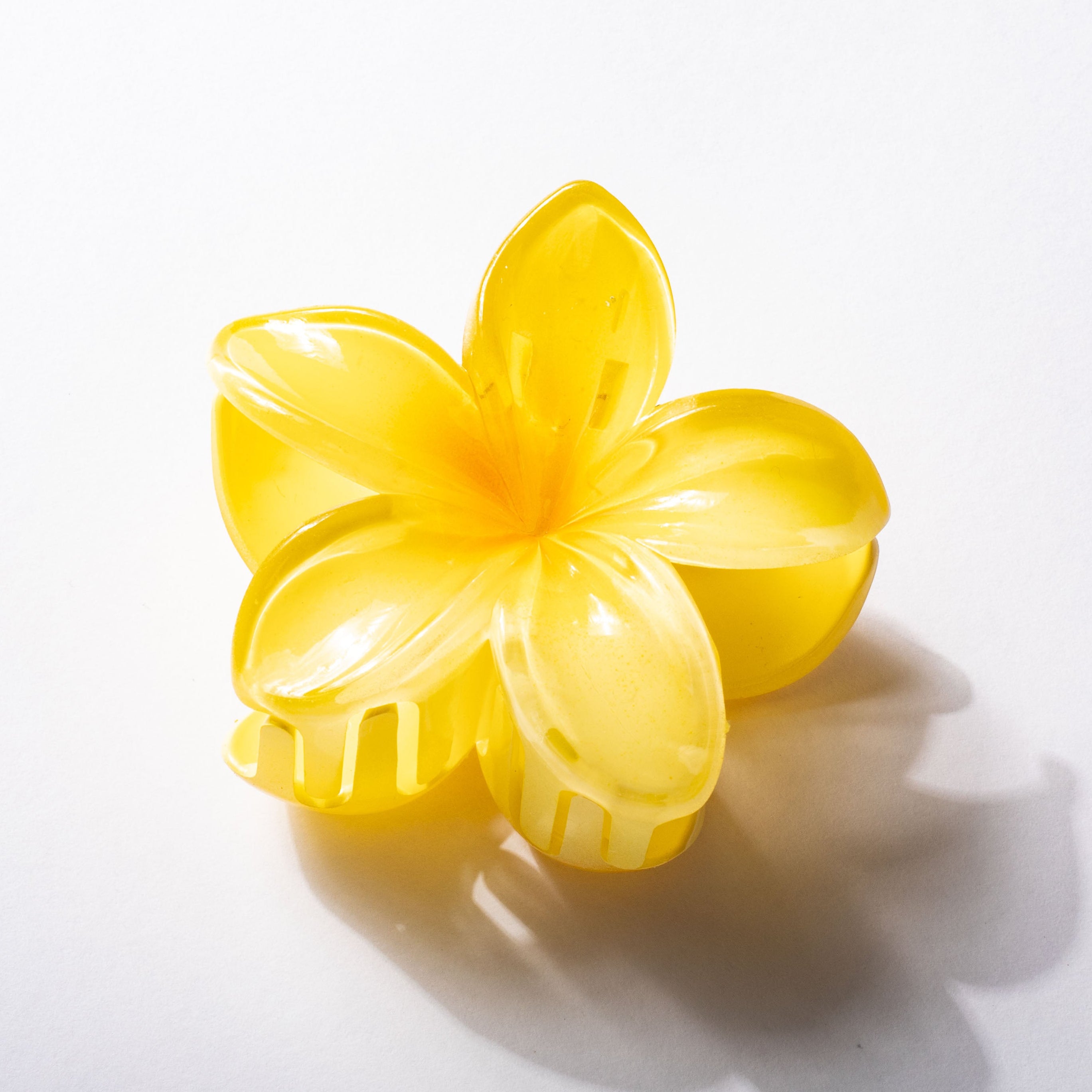 Yellow flower-shaped object on a white background
