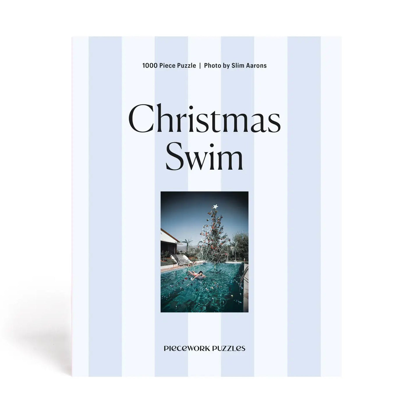 Puzzle box titled 'Christmas Swim' with a photo of a person in a pool and a Christmas tree.
