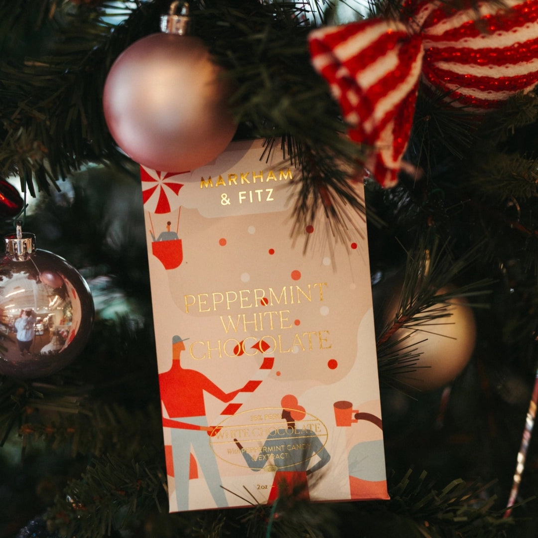 Packaging of Markham & Fitz Peppermint White Chocolate on a Christmas tree.
