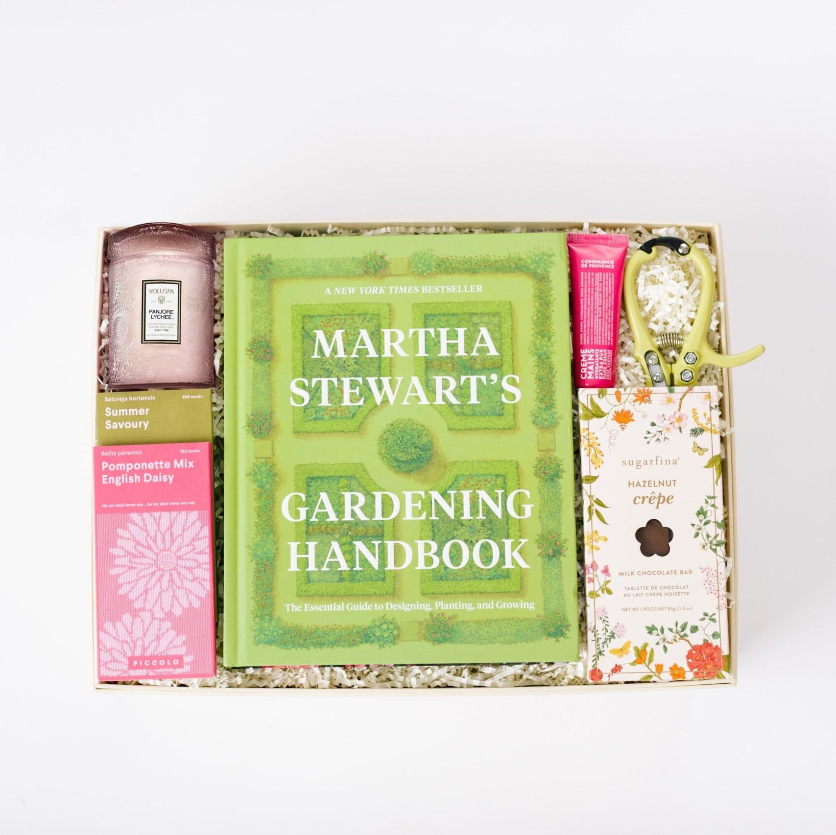Martha Stewart's Gardening Handbook in a gift box with other items on a white background