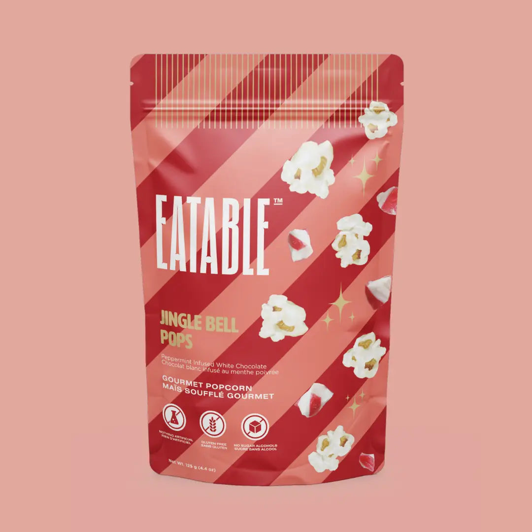 Eatable Jingle Bell Pops packaging on a pink background