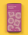 Purple packaging of 'Baking with Flowers' seed collection on a yellow background