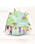 book opened to page of children hugging the world