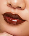 Close-up of a person wearing a dark brown lip color