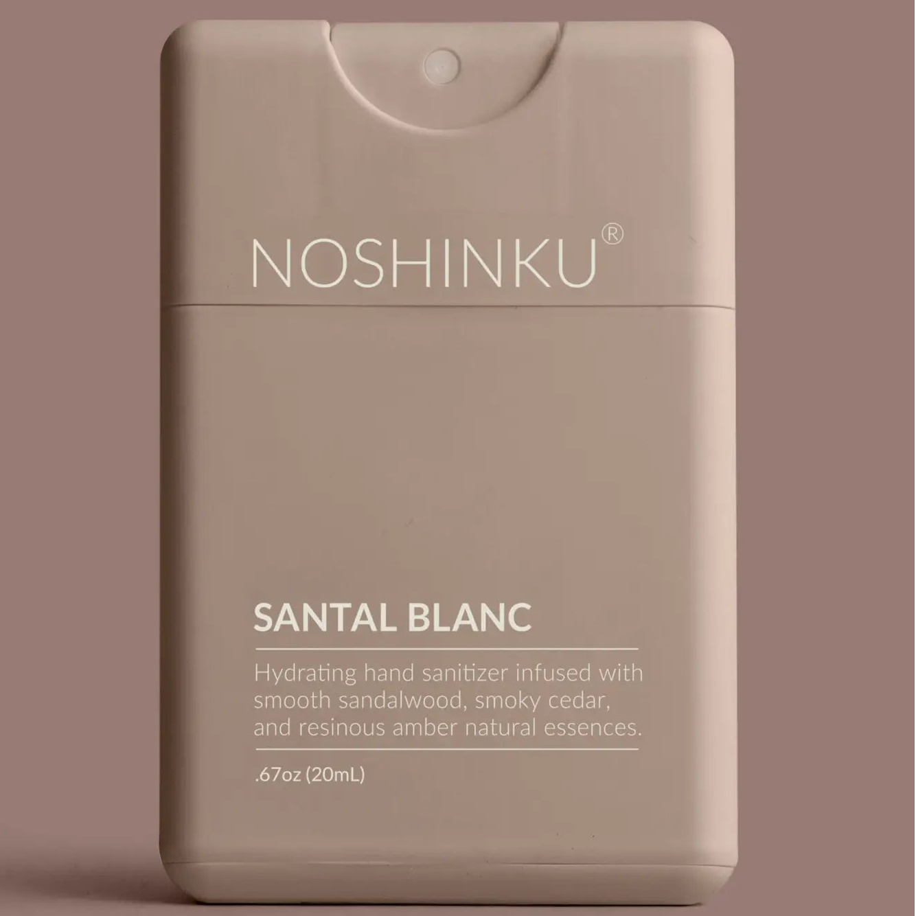 Noshinku Santal Blanc hand sanitizer packaging on a brown background