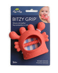 Red silicone teether with packaging displaying 'itzy ritzy' brand and product name.