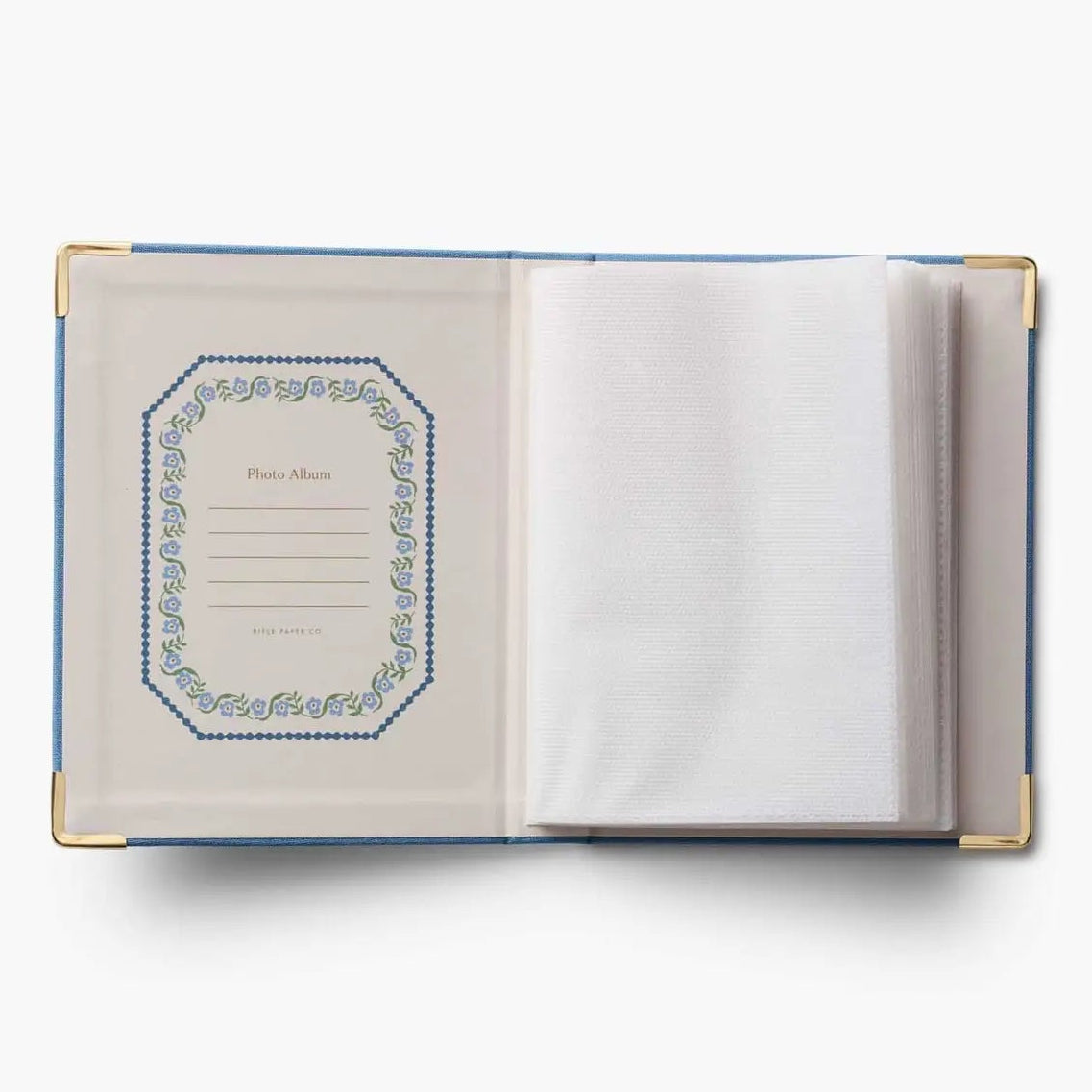 Open notebook with decorative cover on a white background