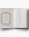 Open notebook with decorative cover on a white background